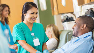 Man donating plasma in hospital