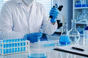 Scientist using a pipette
